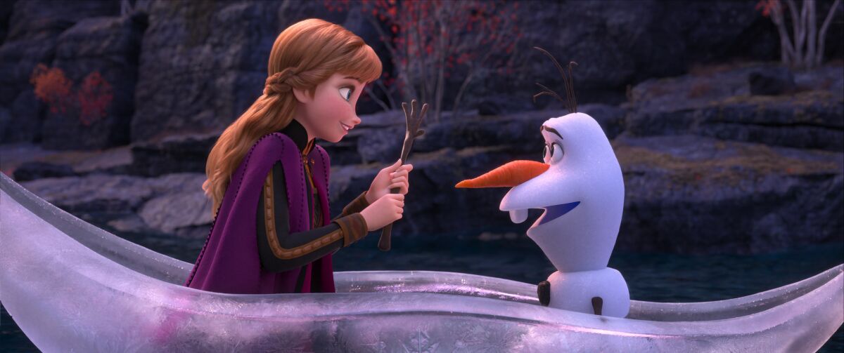Anna (voiced by Kristen Bell) and Olaf (voiced by Josh Gad) in "Frozen 2."