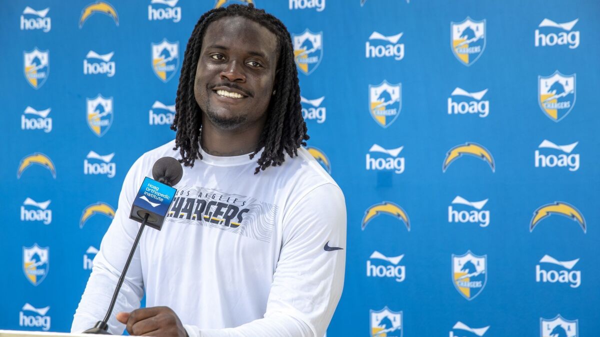 Melvin Ingram III talks with reporters at Hoag Performance Center Field after the Chargers first minicamp of the season in Costa Mesa on Tuesday.