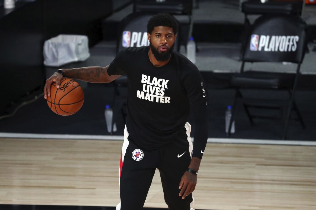 Clippers guard Paul George warms up for Game 5 of an NBA first-round playoff series against the Dallas Mavericks.