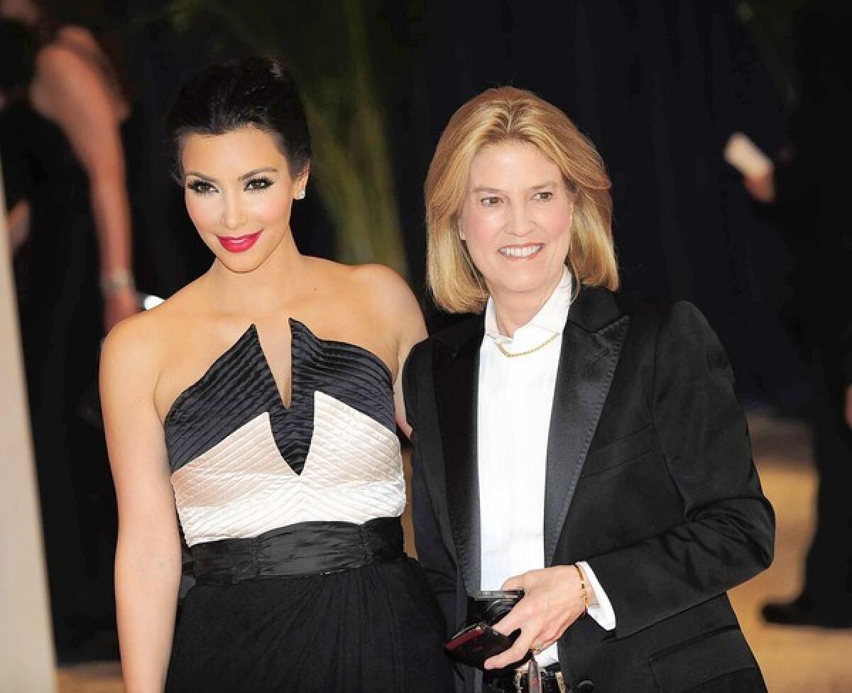 Greta Van Susteren, right, pictured with Kim Kardashian, favors black blazers and crisp white button-down shirts.
