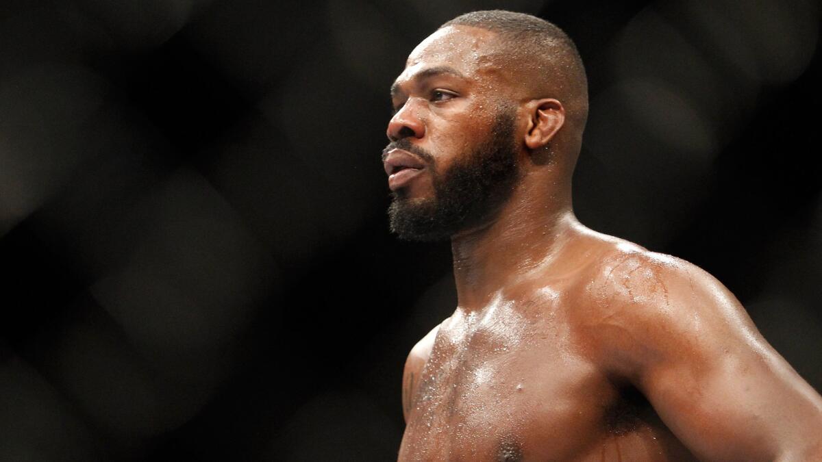 Light heavyweight champion Jon Jones waits during a timeout while battling Daniel Cormier on Jan. 3. Jones tested positive for cocaine weeks before the fight.