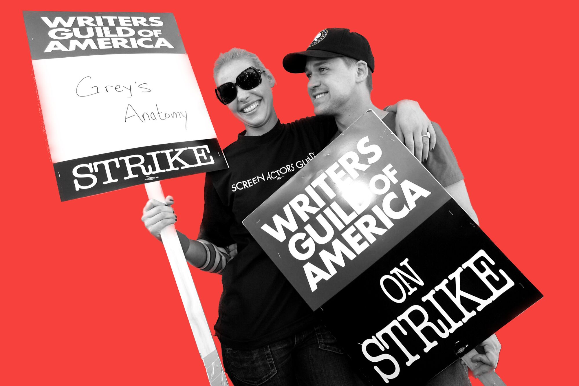 Actors Katherine Heigl and T.R. Knight march in support of striking members of the Writers Guild of America.