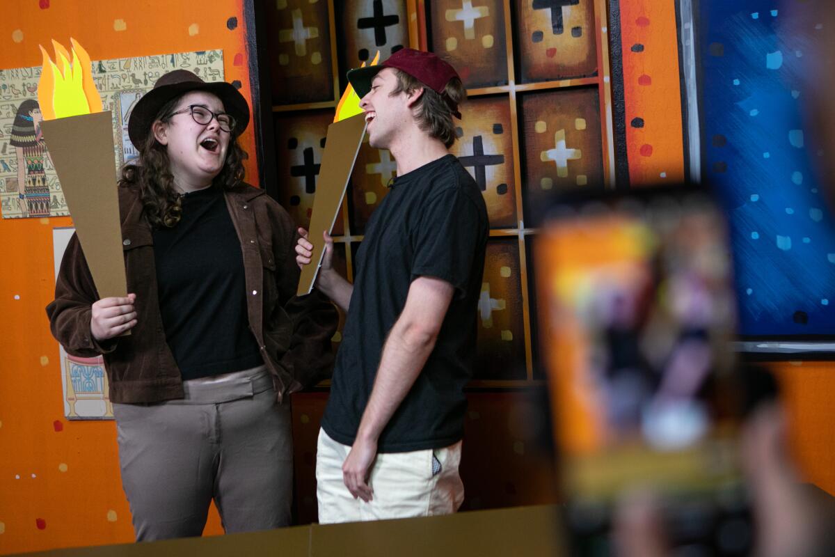 A woman and a man rehearse a scene for the TikTok comedy show "Stapleview."