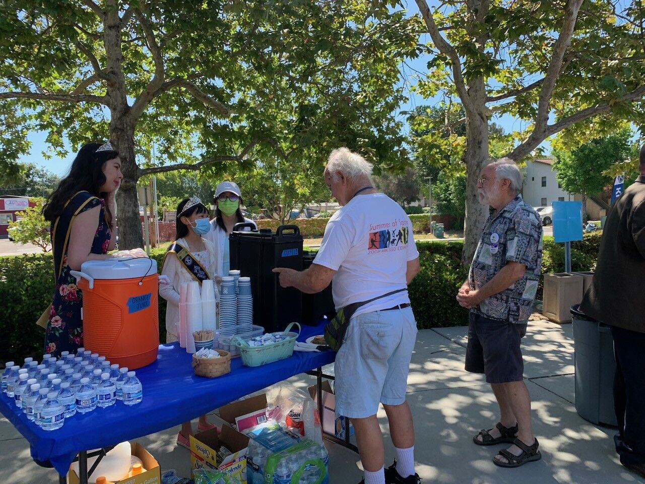 Poway Kiwanis princesses serve coffee at the library on June 18.
