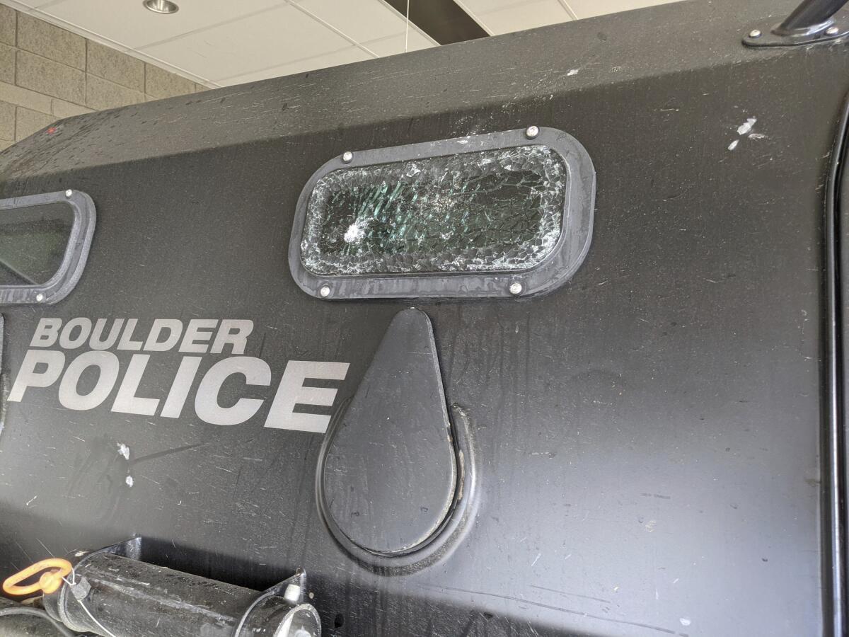 This Sunday, March 7, 2021, photo released by the City of Boulder shows cracked windows of a Terradyne light armored patrol vehicle at the Boulder Police Department in Boulder, Colo. Boulder Police confirms three members of their SWAT team were injured with bricks and rocks. They also say their armored rescue vehicle and fire truck sustained heavy damage. Authorities say they will seek criminal charges against participants in a massive party near the University of Colorado that devolved into a violent confrontation with police this weekend. (Boulder Police Department/ City of Boulder via AP)