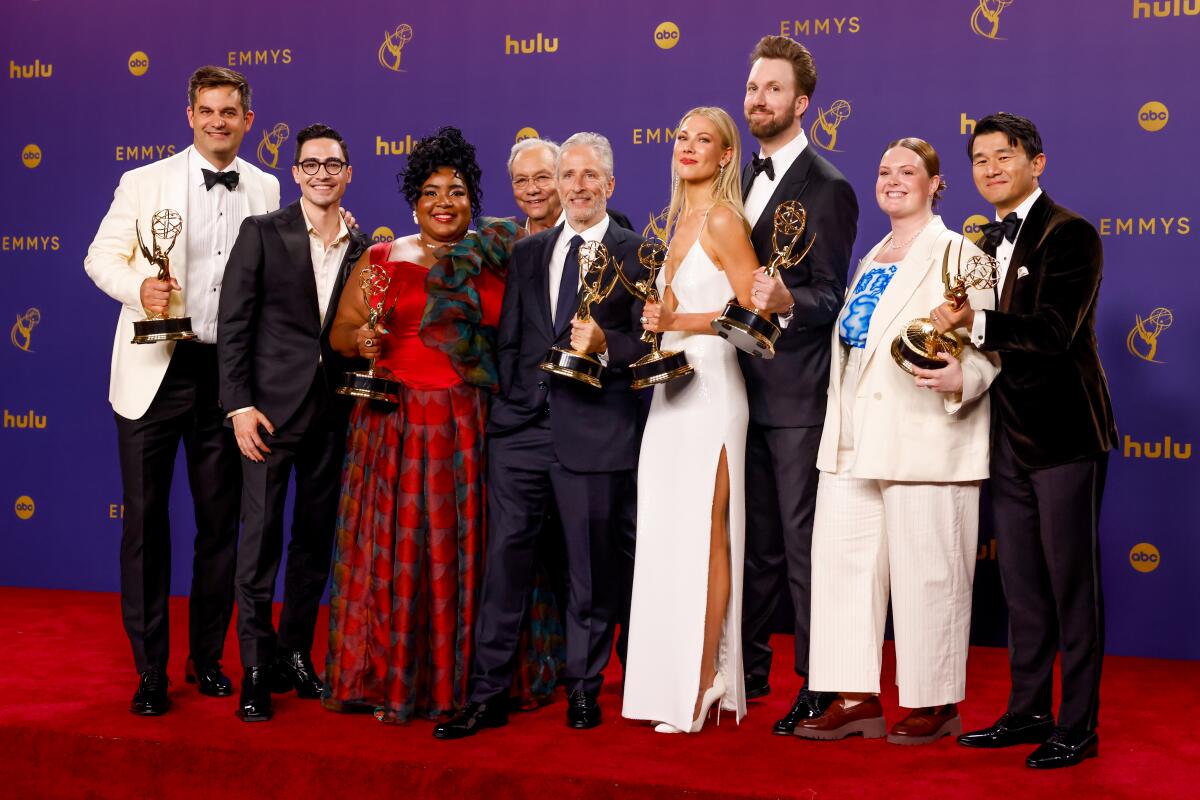 Jon Stewart, center, and the rest of the winning team behind "The Daily Show" at the 2024 Emmys.