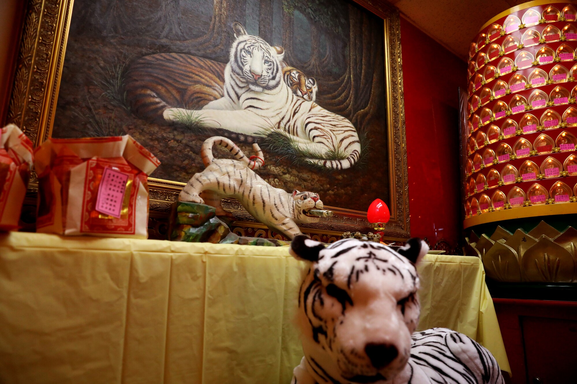 A shrine with a tiger painting and other elements at the Wong Tai-Sen Taoism Center draws the faithful to Monterey Park.