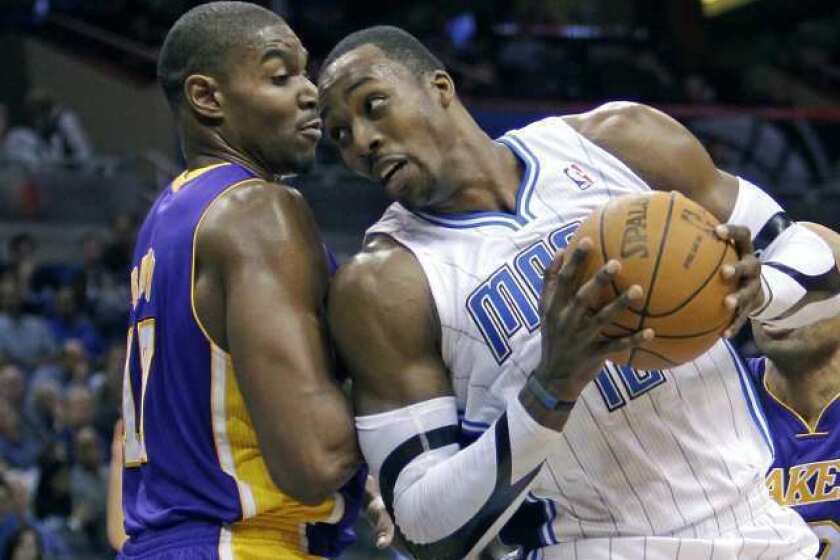 Orlando's Dwight Howard, right, pushes past Andrew Bynum during the second half of a Jan. 20 game.