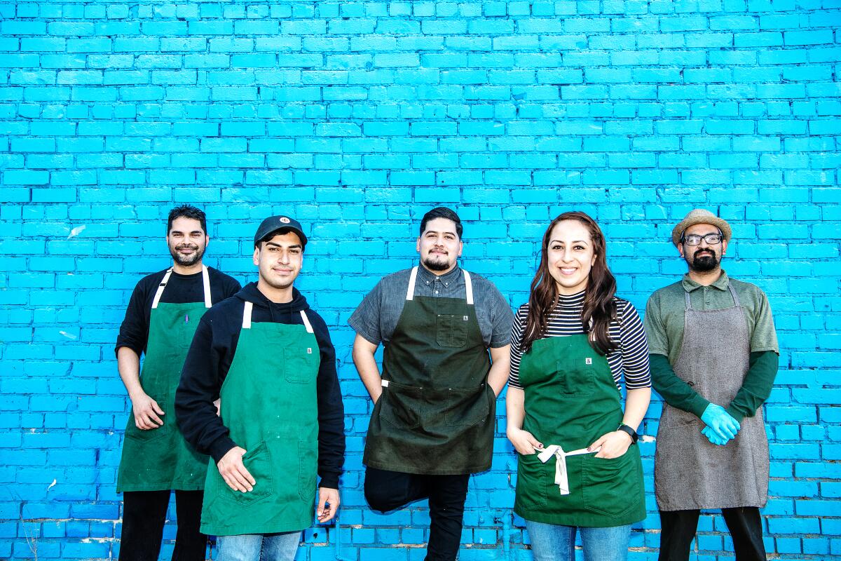 Jonathan Perez of Macheen, center, with staff from Macheen and Cafe Cafe Mobile Coffee pop-ups