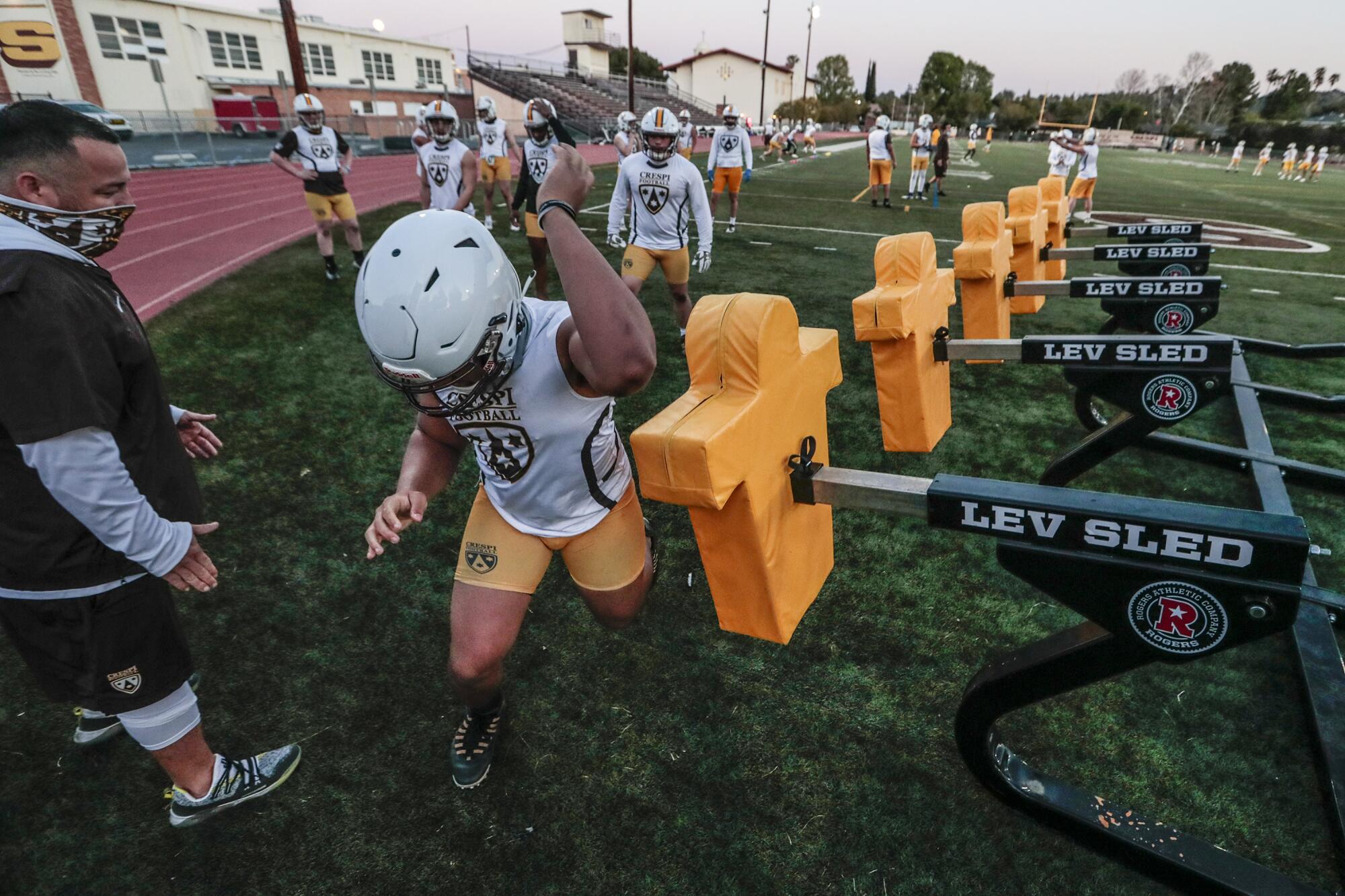 Crespi players go through drills at the first practice. 