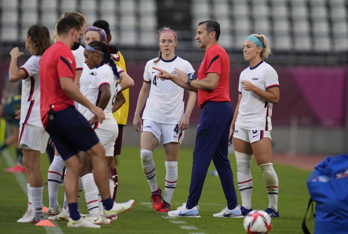 U.S. women's soccer coach Vlatko Andonovski talks with players at the Tokyo Olympics.