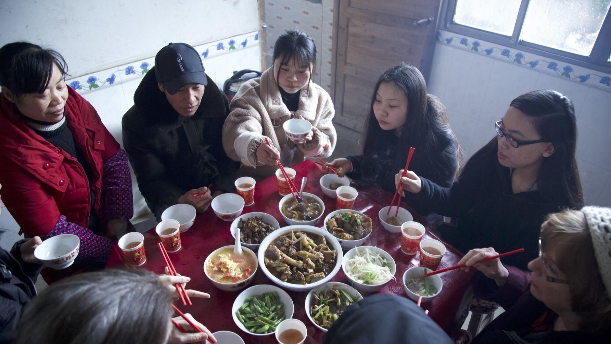 The twins eat with their birth parents and Esther's adoptive mother