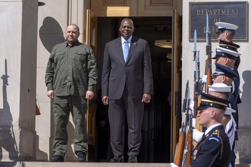 Defense Secretary Lloyd Austin, right, stands with Ukraine's Defense Minister Rustem Umerov during an arrival ceremony at the Pentagon, Tuesday, July 2, 2024, in Washington. (AP Photo/Jacquelyn Martin)