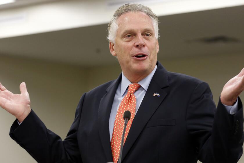 FILE - In this Monday, Aug. 21, 2017, file photo, then-Virginia Gov. Terry McAuliffe delivers his annual budget projection at the Capitol in Richmond, Va. Former Virginia Gov. McAuliffe won't run for president in 2020, according to two people familiar with calls he made Wednesday, April 17, 2019, to allies. (AP Photo/Steve Helber, File)