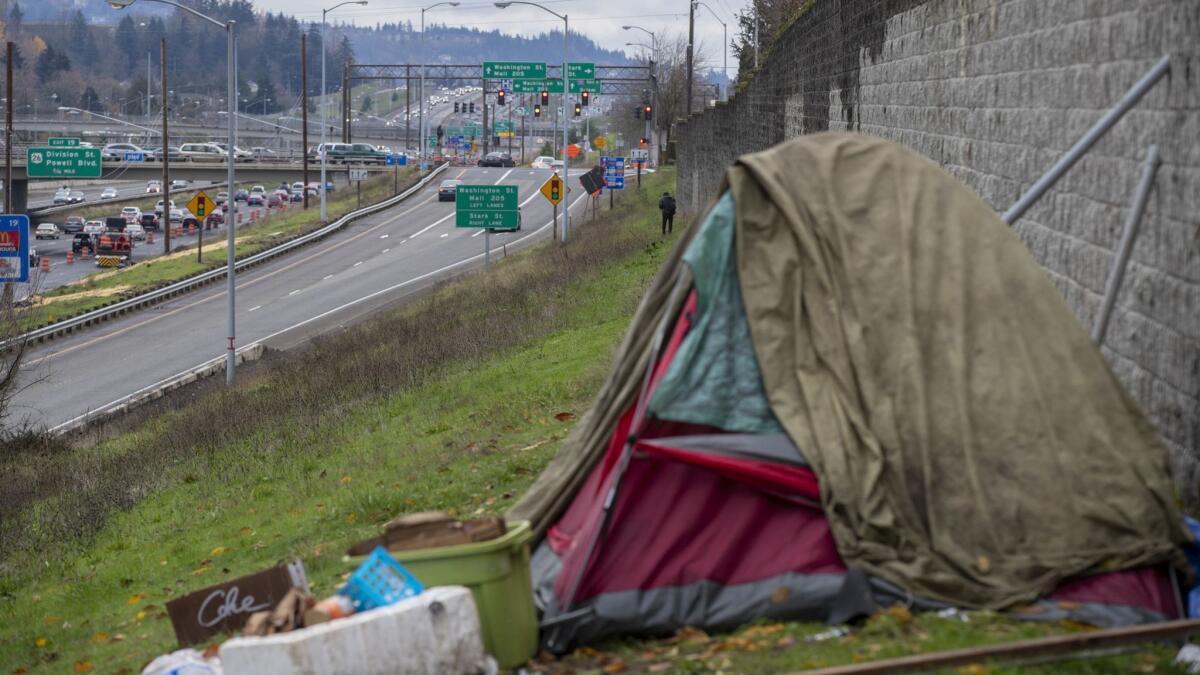 PORTLAND, ORE. -- SATURDAY, DECEMBER 1, 2018: A homeless encampment along Interstate 205 in the Montavilla neighborhood of Portland, Ore., on Dec. 1, 2018. (Brian van der Brug / Los Angeles Times)