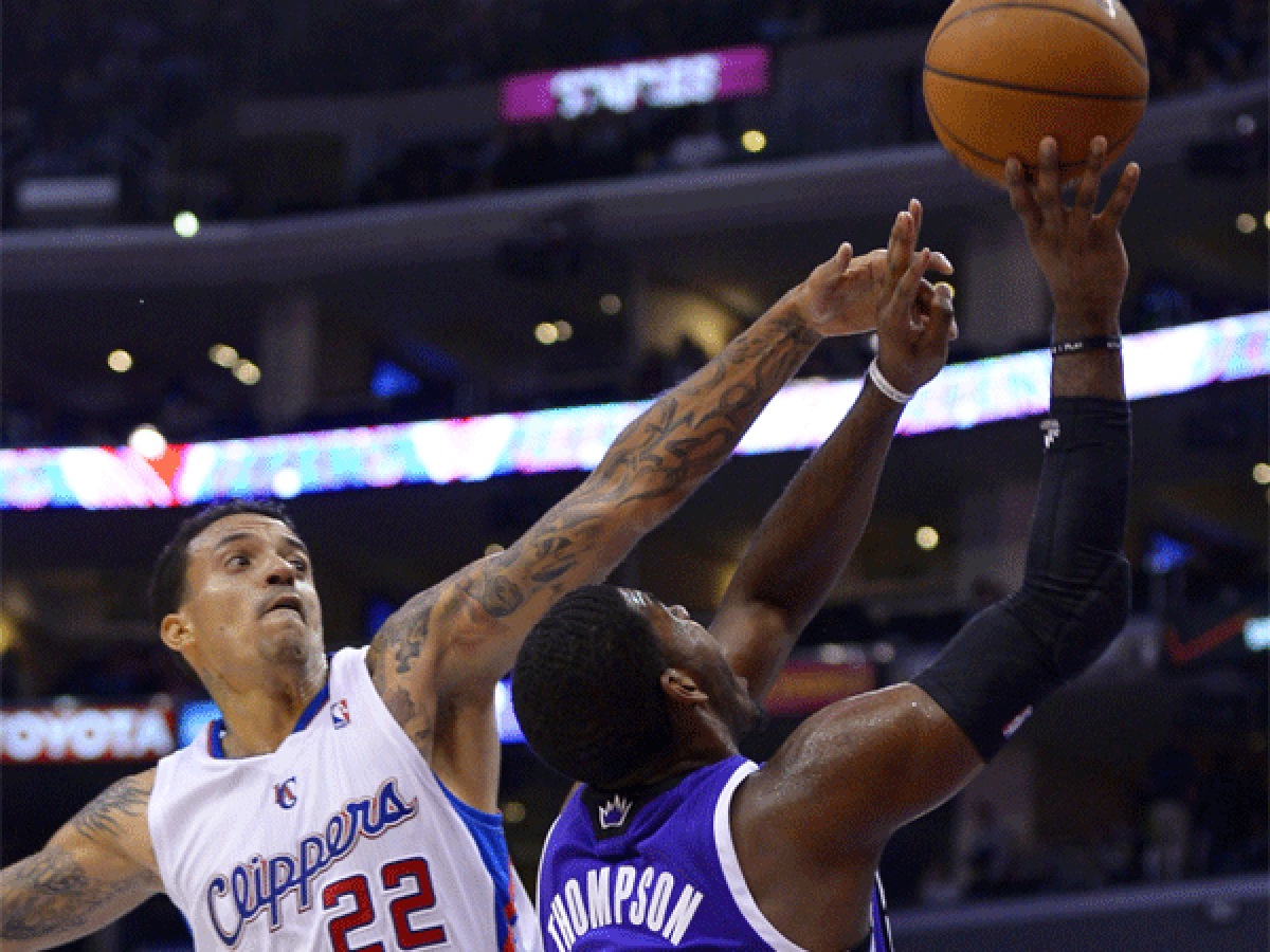 Matt Barnes fouls Sacramento's Jason Thompson during the Clippers' 110-100 loss Friday night.