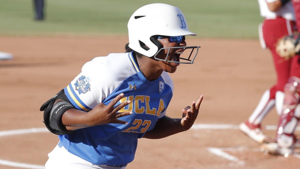 UCLA's Aaliyah Jordan celebrates after hitting a home run against Oklahoma in Game 1 of the Women's College World Series on June 3.