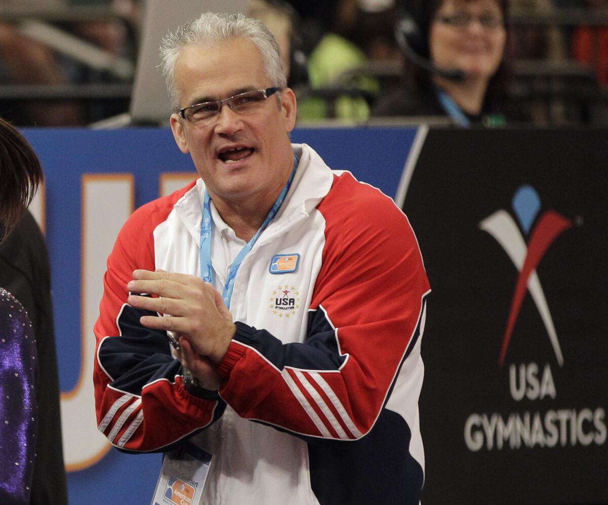 ARCHIVO - En esta foto del 3 de marzo de 2012, el entrenador de gimnasia John Geddert.