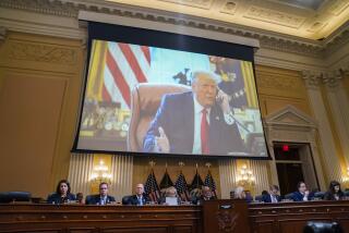 WASHINGTON, DC - DECEMBER 19: An image of former President Donald Trump is displayed during the final hearing of the House Select Committee to Investigate the January 6 Attack on the U.S. Capitol, in the Canon House Office Building on Capitol Hill on December 19, 2022 in Washington, DC. The committee is expected to approve its final report and vote on referring charges to the Justice Department. (Kent Nishimura / Los Angeles Times)