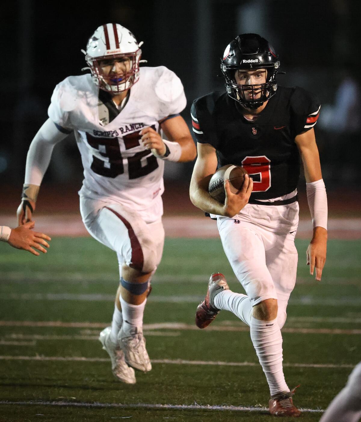La Jolla quarterback Jackson Diehl runs with the ball against Scripps Ranch on Aug. 25 at La Jolla High.