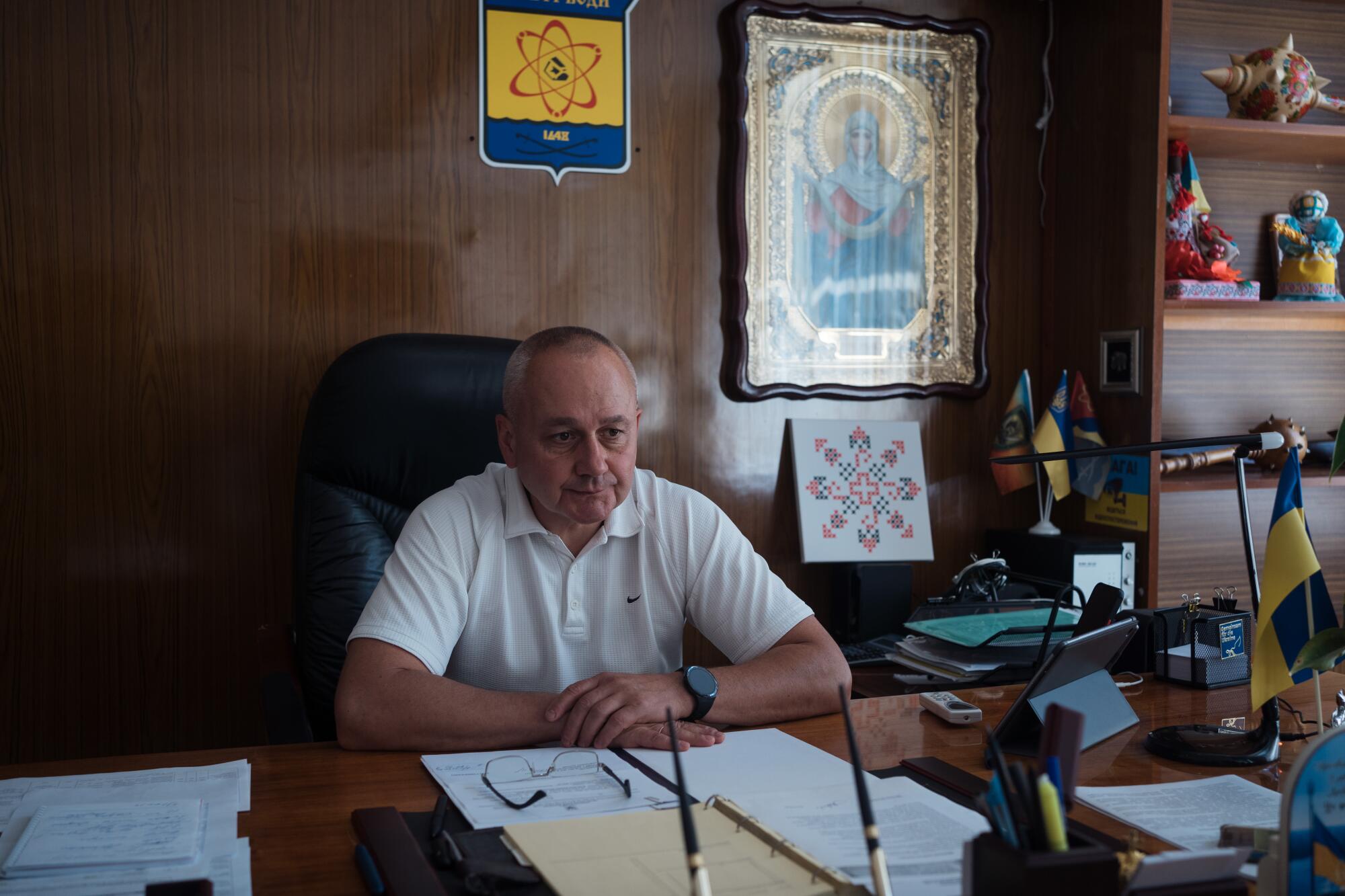 A man sits at a desk 