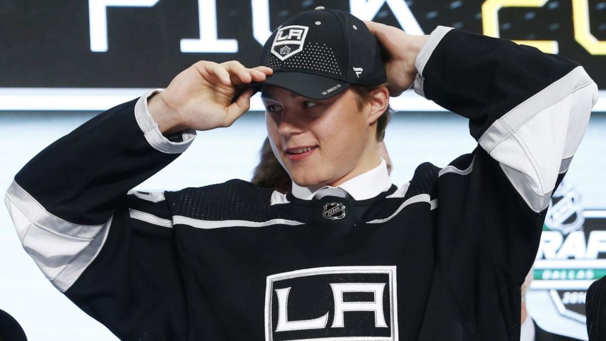 Rasmus Kupari adjusts his cap after being selected by the Kings during the 2018 NHL draft in Dallas.