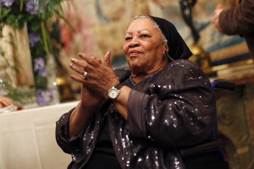 FILE - In this Sept. 21, 2012, file photo, U.S. novelist Toni Morrison applauds as she attends the America Festival at the U.S. embassy, in Paris. A book of Toni Morrison quotations is coming out in December 2019. “The Measure of Our Lives: A Gathering of Wisdom” will draw from her whole body of work, including such celebrated novels as “Beloved” and “Song of Solomon.” The foreword is by Zadie Smith, adapted from a tribute she wrote soon after the Nobel laureate died in August 2019 at age 88. (AP Photo/Thibault Camus, File)