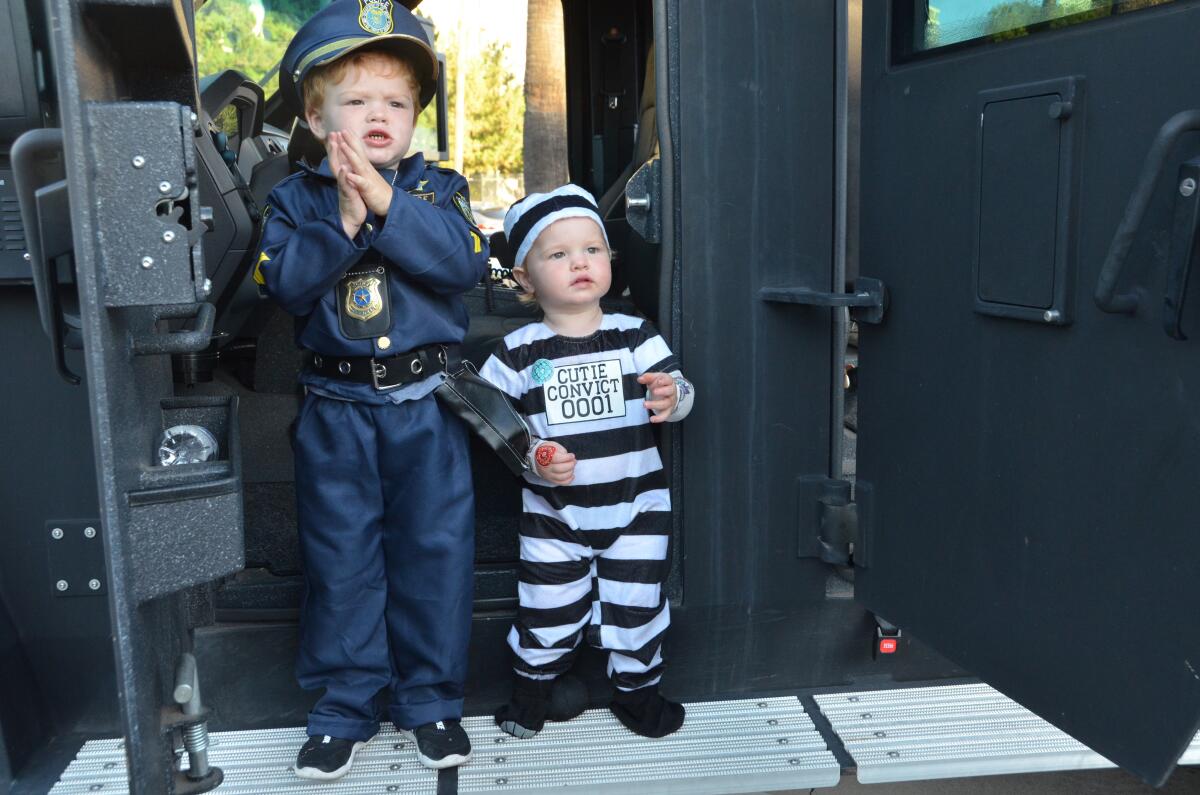  Three-year old-police officer Austin, left, and 1 year old Jailbird Nolan Chaplin pose for photo.
