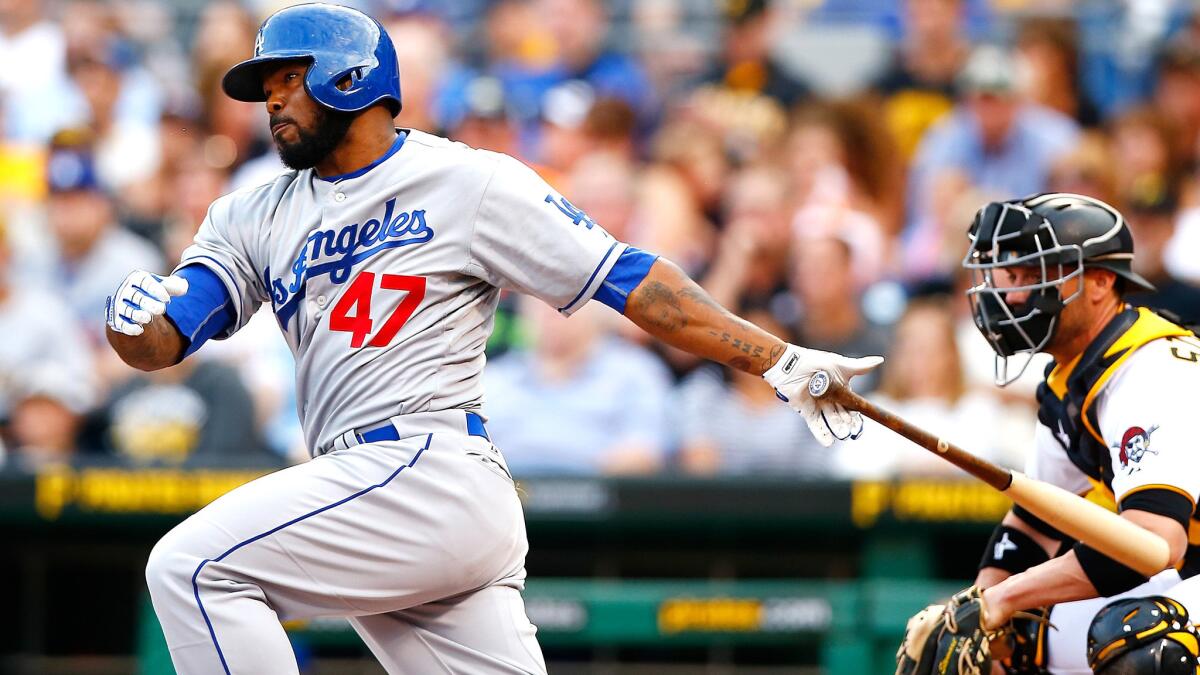 Dodgers second baseman Howie Kendrick delivers a two-run single against the Pirates during a game Aug. 7 in Pittsburgh.