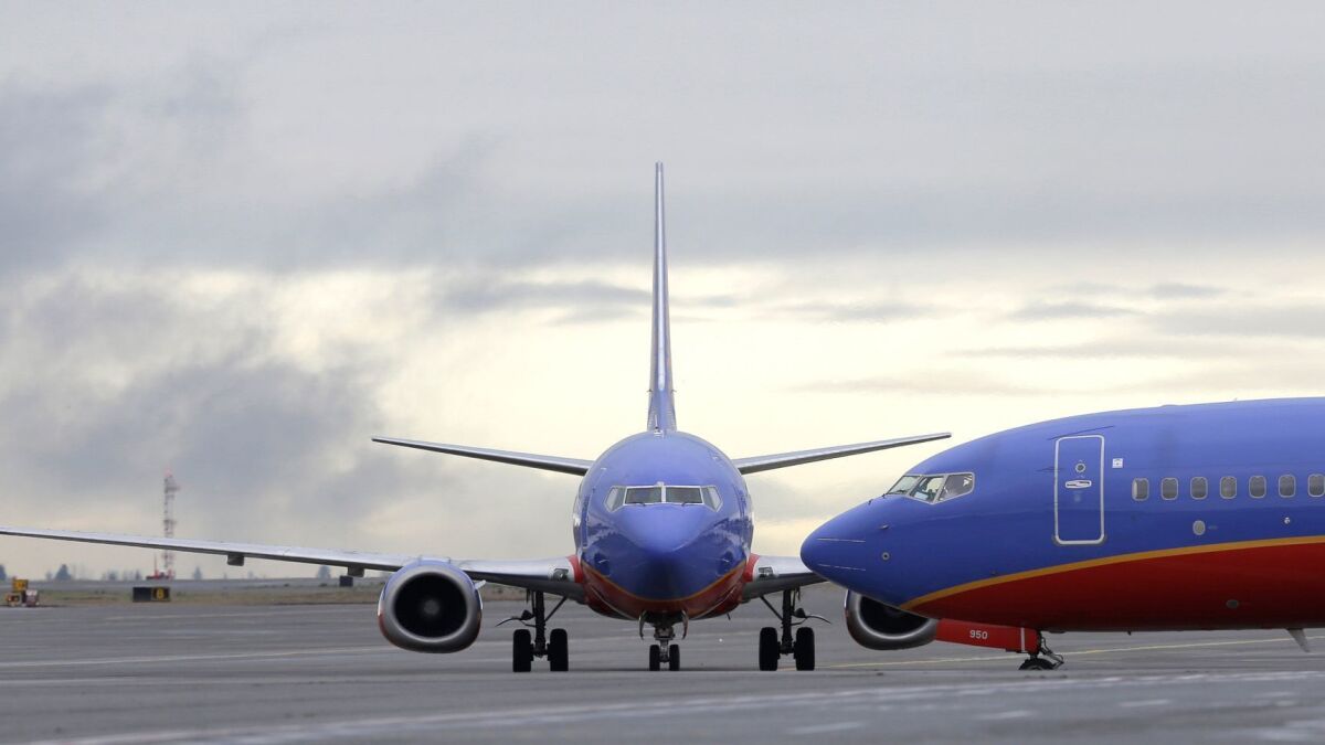 A Southwest Airlines 737 at Seattle-Tacoma International Airport. Southwest believes the partial federal government shutdown “likely” will delay its plans to begin service to Hawaii.