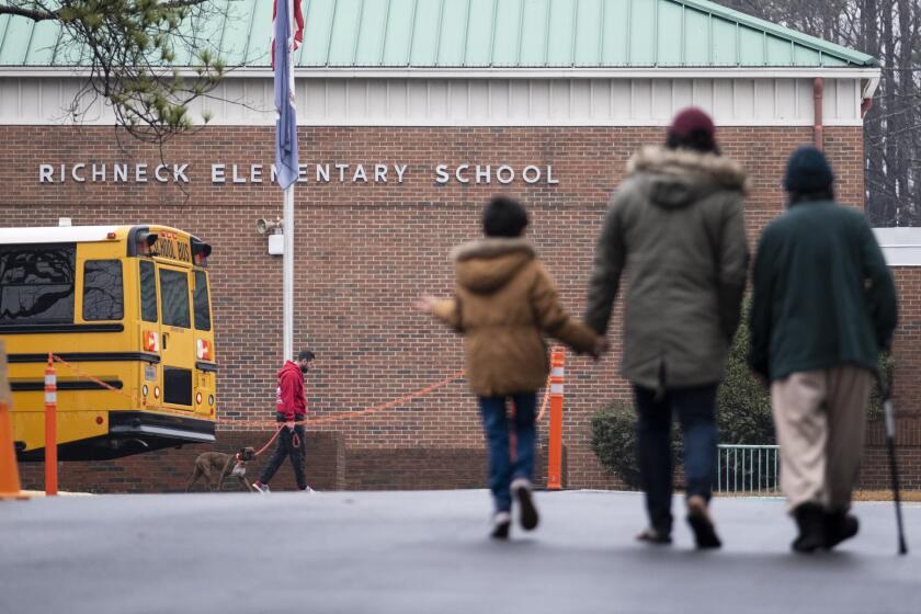 FILE - Students return to Richneck Elementary in Newport News, Va., on Jan. 30, 2023. The mother a 6-year-old who shot his teacher in Virginia is expected to plead guilty Tuesday, Aug. 15, 2023, seven months after her son used her handgun in the classroom shooting. (Billy Schuerman/The Virginian-Pilot via AP)