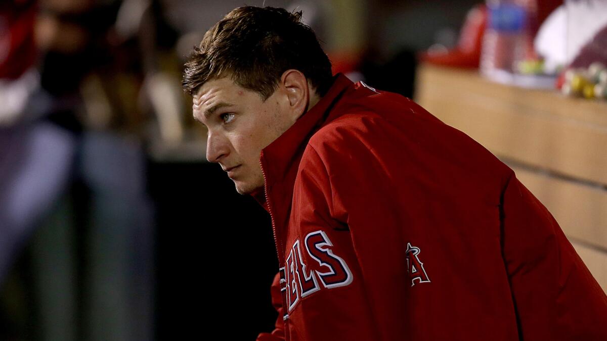 Angels starter Garrett Richards sits in the dugout during the team's 6-2 victory over the Minnesota Twins on Wednesday night.