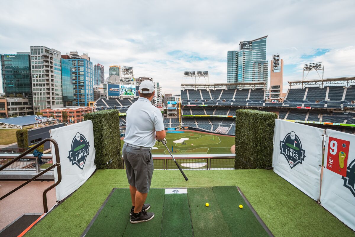 A golfer plays at the Links at Petco Park.