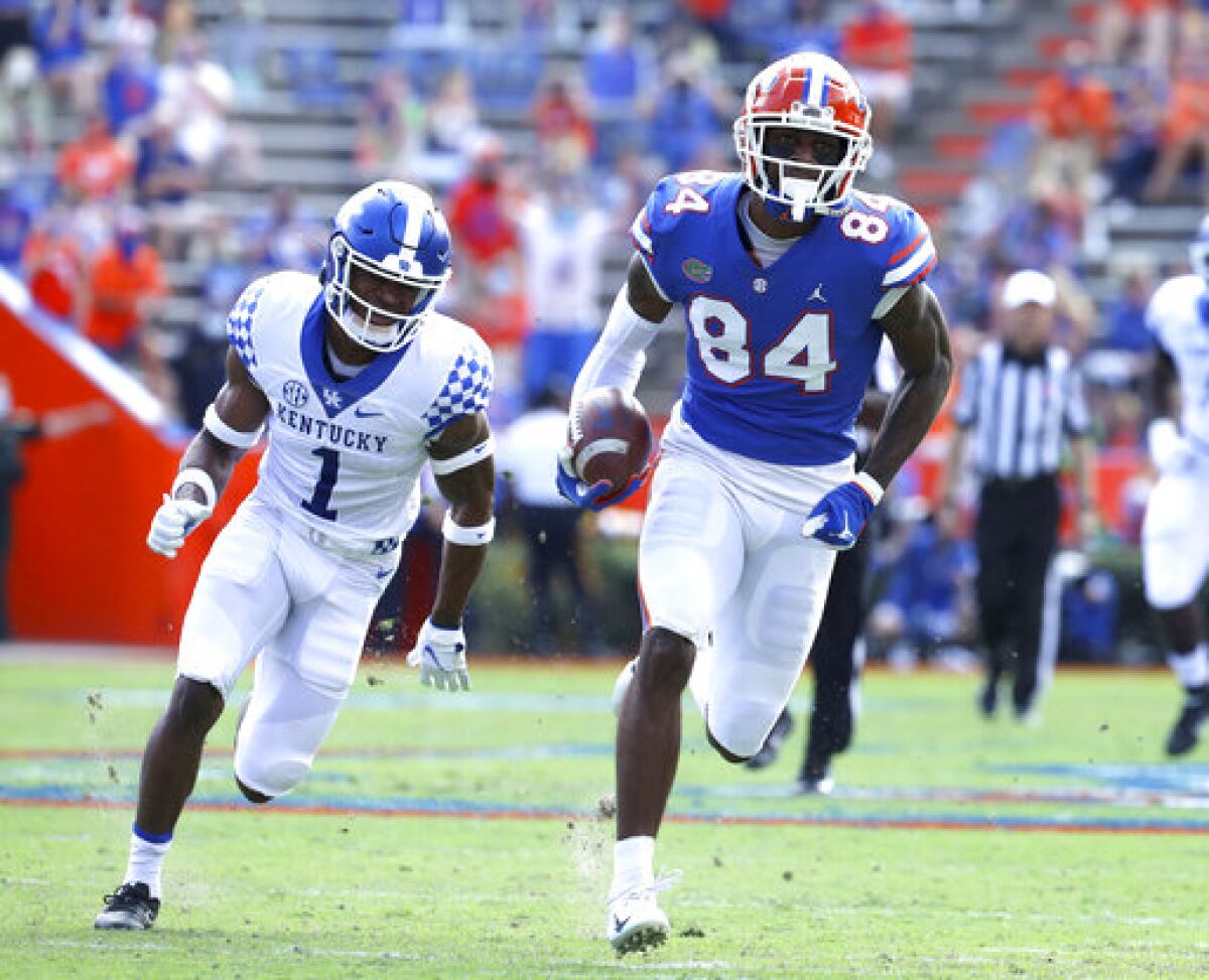 Florida tight end Kyle Pitts (84) runs after catching a pass to score a touchdown during an NCAA college football game against Kentucky in Gainesville, Fla. Nov. 28, 2020. (Brad McClenny/The Gainesville Sun via AP)