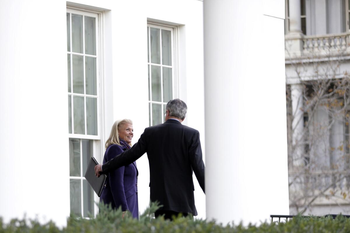 IBM CEO Virginia Rometty, left, and Chevron CEO John Watson leave the White House after a meeting with President Obama in 2012.