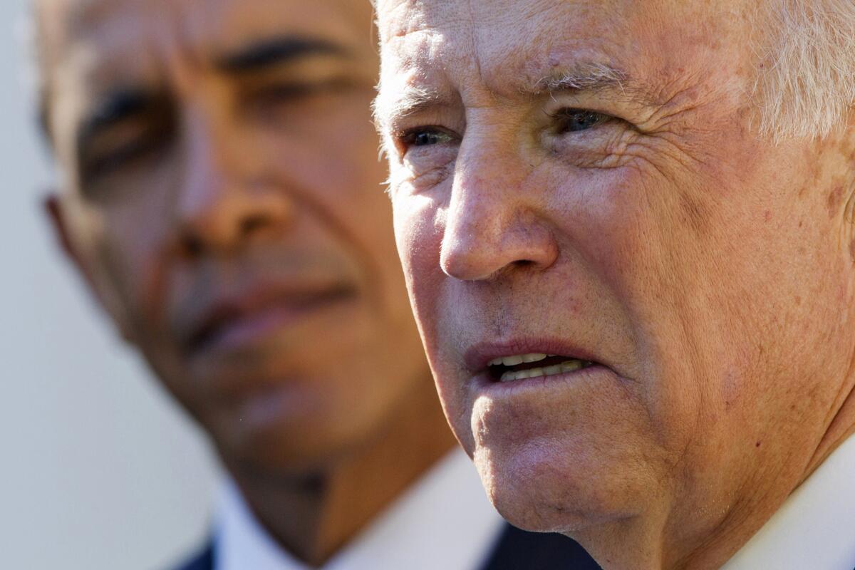 President Barack Obama listens as Vice President Joe Biden announces that he will not run for the presidential nomination on Oct. 21.