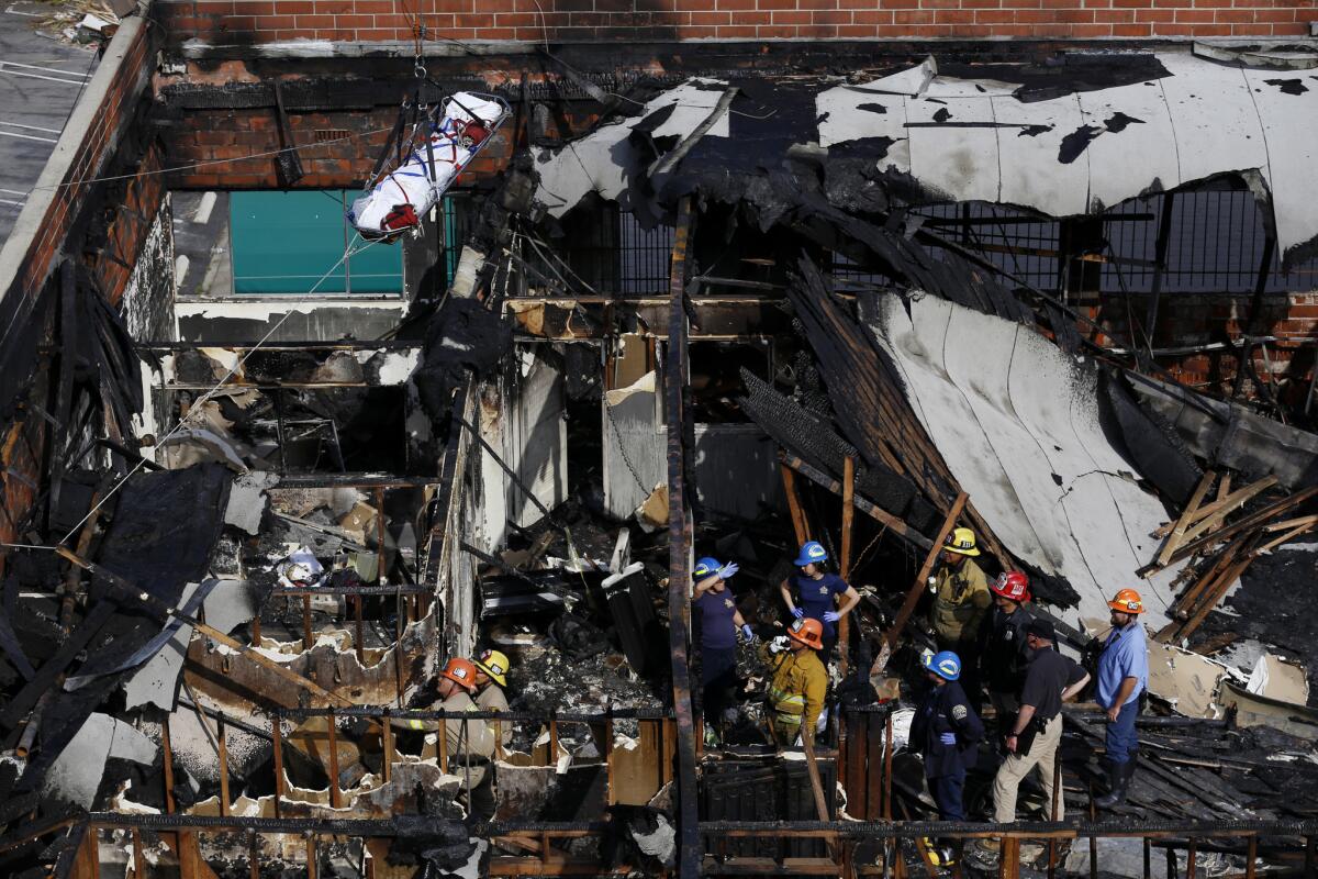 The scene of a vacant building where five homeless people died in a fire that authorities say was deliberately set by a man who was in the country illegally.