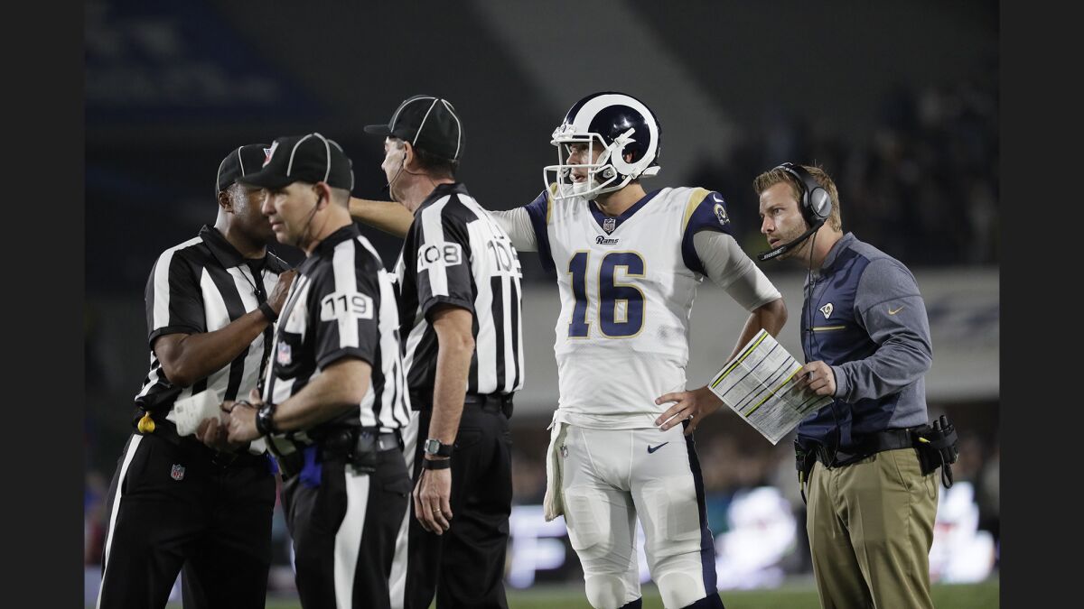 Rams quarterback Jared Goff and coach Sean McVay look on as officials discuss a goal-line play with a few seconds remaining in the first half against the Atlanta Falcons on Saturday.