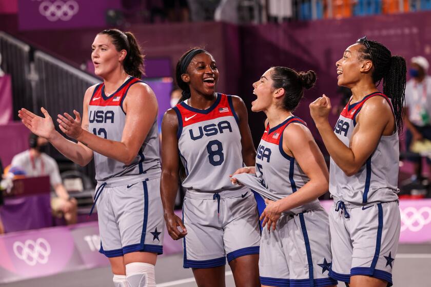 Tokyo, Japan, Wednesday July 28 2021 - A. Jubilant USA celebrate moments after winning Gold in the the 3X3 Women Basketball Final. Left to right are, Stefanie Dolson, Jaqueline Law, Kelsie Plum and Allisha Gray. (Robert Gauthier/Los Angeles Times)