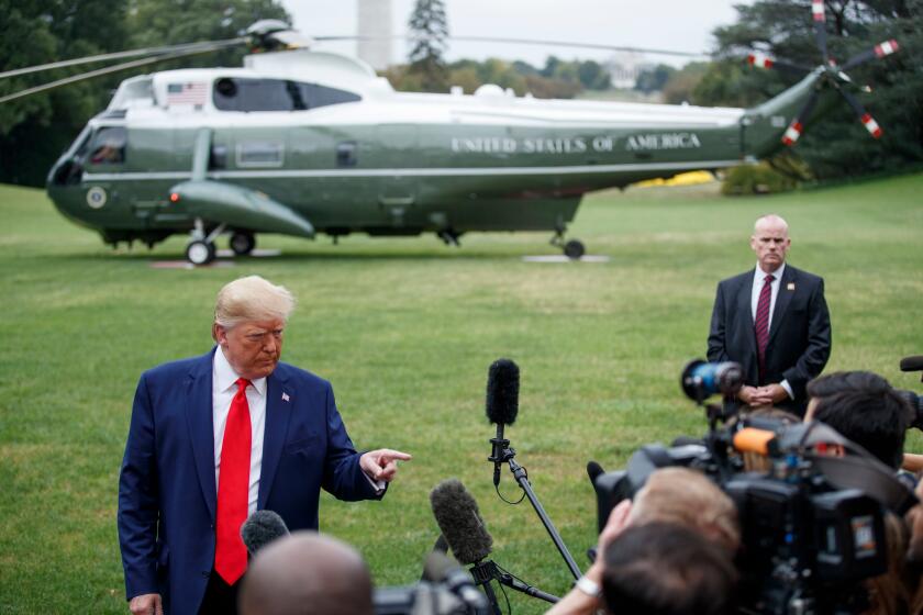 Mandatory Credit: Photo by SHAWN THEW/EPA-EFE/REX (10435239k) US President Donald J. Trump responds to a question from the news media as he walks to board Marine One on the South Lawn of the White House in Washington, DC, USA, 03 October 2019. President Trump is traveling to Florida to deliver remarks and sign the 'Protecting and Improving Medicare for our Nation's Seniors' Executive Order. US President Donald J. Trump departs the White House for Florida, Washington, USA - 03 Oct 2019 ** Usable by LA, CT and MoD ONLY **