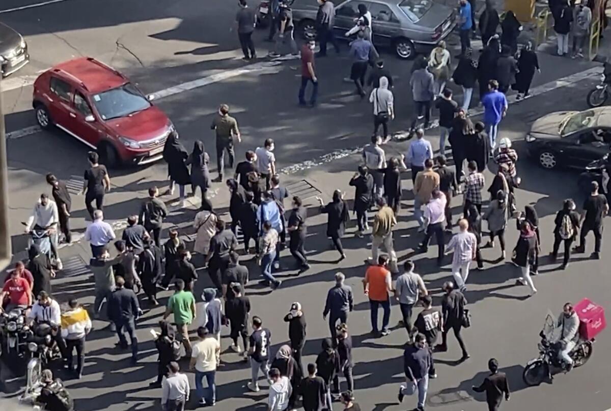 An aerial view of people blocking an intersection during a protest.