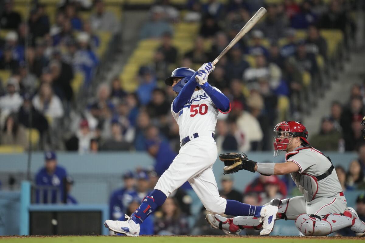 Mookie Betts hits a home run during the seventh inning of the Dodgers' 13-4 win.