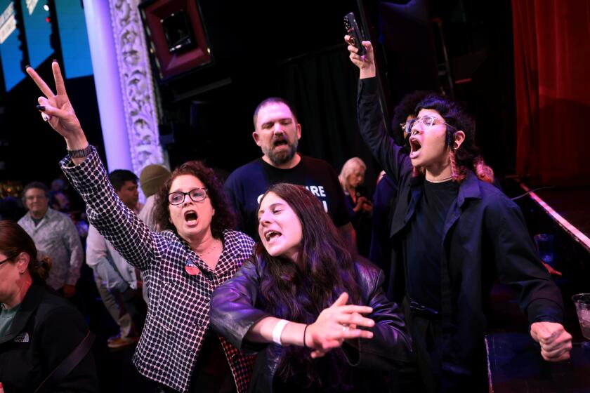 Los Angeles, California March 6, 2024- Protestors yell as Adam Schiff speaks during an election party at the Avalon in Los Angeles Tuesday night as he seeks to replace Sen. Diane Feinstein in the Senate. (Wally Skalij/Los Angeles Times)