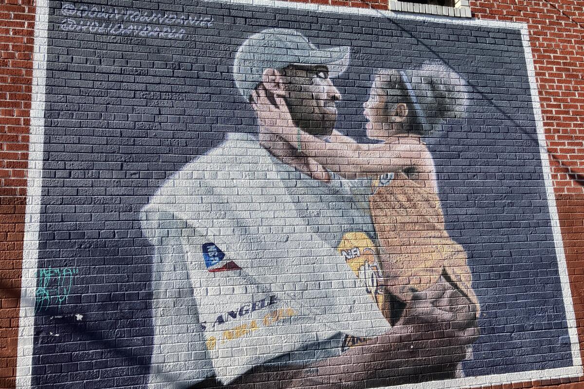 Kobe Bryant is staring into his daughter Gianna's eyes in a mural outside the Holiday Bar in Boyle Heights.