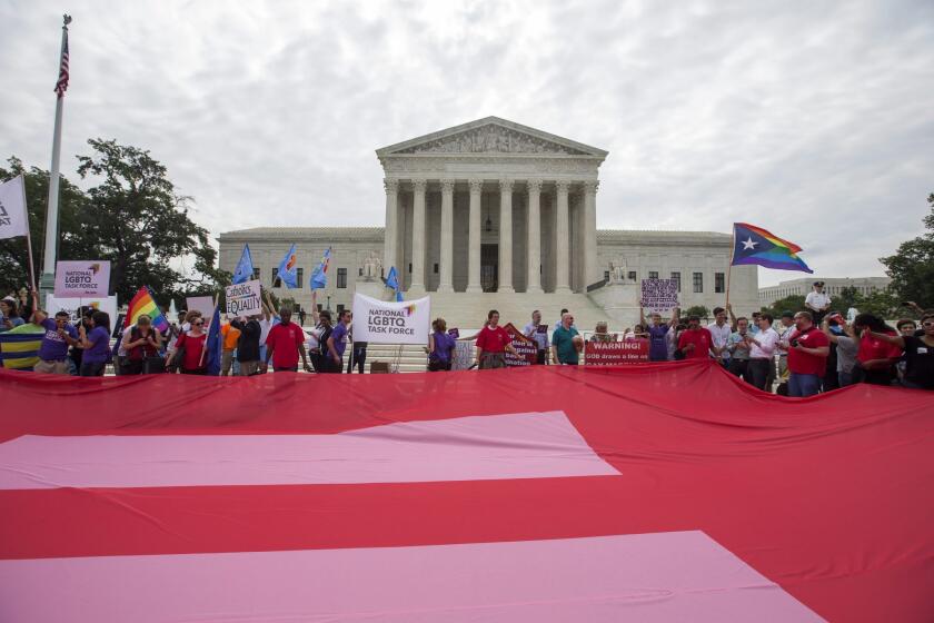 Supporters of same-sex marriage unfurl a so-called equality flag outside the Supreme Court on Friday, where the Supreme Court clears the way for same-sex marriage nationwide.