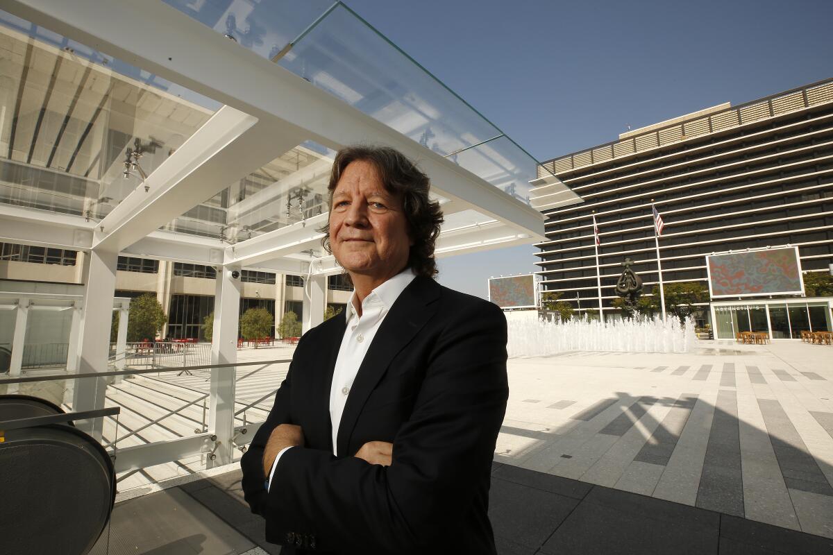 Architect Bob Hale, of Rios Clementi Hale Studios, stands before the redesigned Music Center plaza.