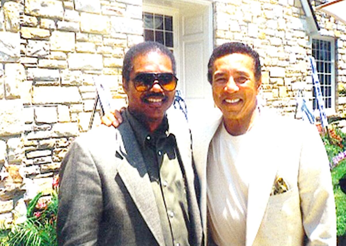 Larry Buford with Smokey Robinson.