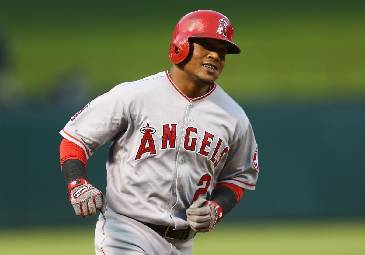 Erick Aybar smiles after hitting a two-run home run off of Texas' Nick Martinez in the second inning. Aybar drove in two runs and scored twice in the Angels' 7-3 win over the Rangers.