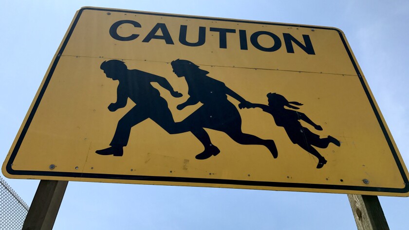 With Only One Left Iconic Yellow Road Sign Showing Running Immigrants Now Borders On The Extinct Los Angeles Times