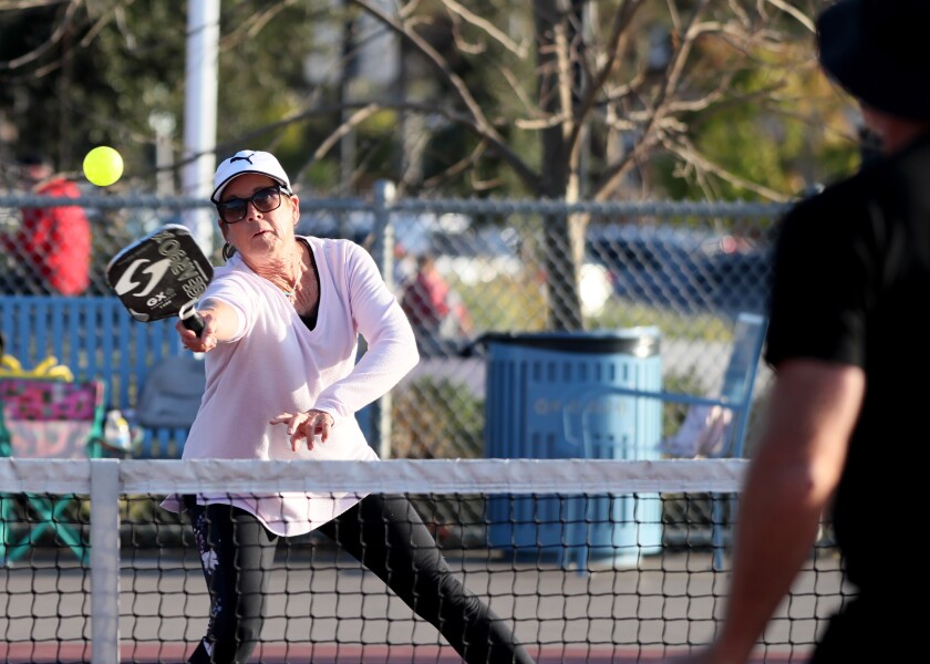 Chris Puccio of Costa Mesa plays pickleball on the courts at Worthy Park in Huntington Beach on Thursday.